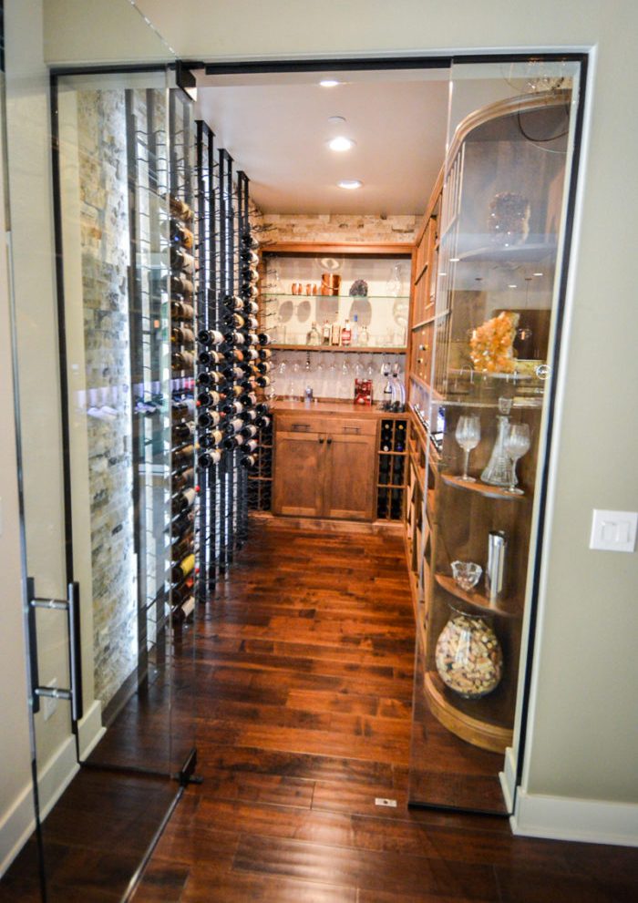 Transitional Residential Custom Wine Cellar in Orange County with Metal and Wood Wine Racks