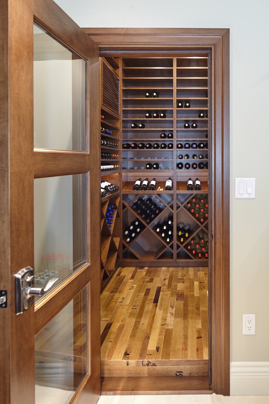 Traditional Residential Custom Wine Cellar in Orange County Imstalled with a Glass Door