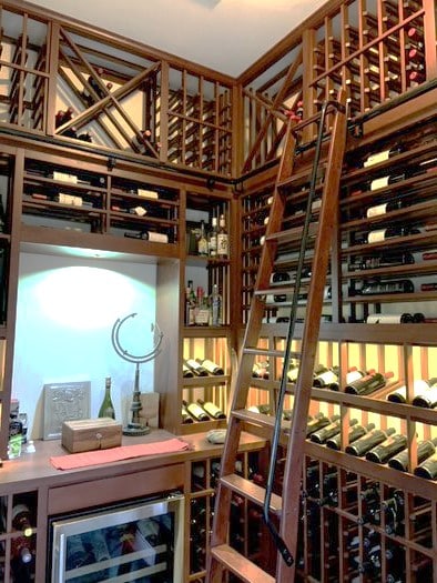 Traditional Custom Wine Cellar with a Rolling Ladder 