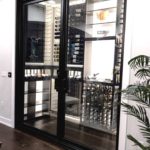 The Exquisite Design of a Modern Glass Wine Display Shown in Wine Cellar Pictures Will Inspire You!
