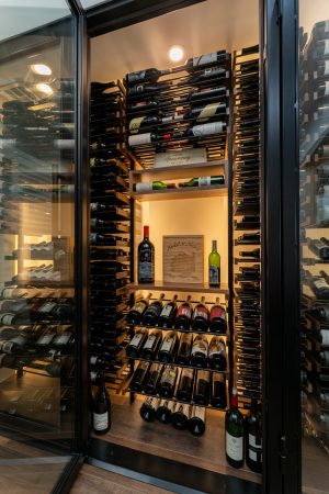 47 - Orange County Modern Wine Cellars made of metal wine racks and walnut lacquer