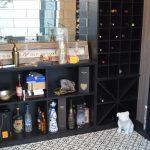 Wooden shelves built in glass enclosed wine cellars in Orange County automatically transforms the space into a contemporary space.