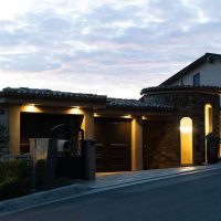 This Orange County home features an elegant modern wine cellar with a stylish cable wine racks. Modern Wine Cellar House Exterior