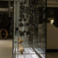 This Orange County modern custom-made glass wine closet offers a complete display of the wine racks. Modern LED Panel for Wine Cellar