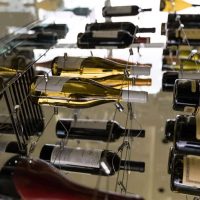 This Orange County home features an elegant modern wine cellar with a stylish cable wine racks. Sturdy Home Wine Cellar Cable Racking Display