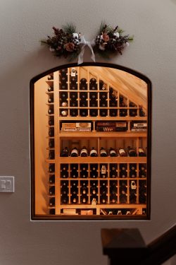 2 - Overlooking Custom Wooden Wine Racks in a Wine Cellar Under Stairs Orang County