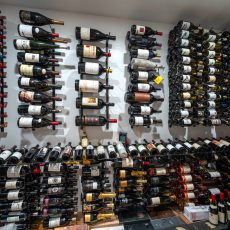 (2) Maximize small spaces with smart, modern wine cellar ideas—this compact cellar uses floor-to-ceiling metal racking and clean wall-mounted displays for a stunning showcase.