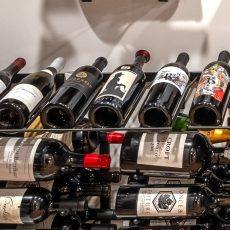 (7) Sleek and space-efficient, these wall-fixed modern wine cellar rack ideas create the illusion of floating bottles, adding a contemporary feel to any wine room.